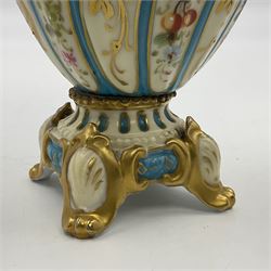 Pair of late 19th/early 20th century Sevres style vases and covers, of baluster form with gilt scroll handles and domed covers, the wrythen fluted bodies decorated with alternating bands of painted fruit and flowers and gilt vines, upon a white and celeste blue ground, with printed and impressed marks beneath, H22.5cm 