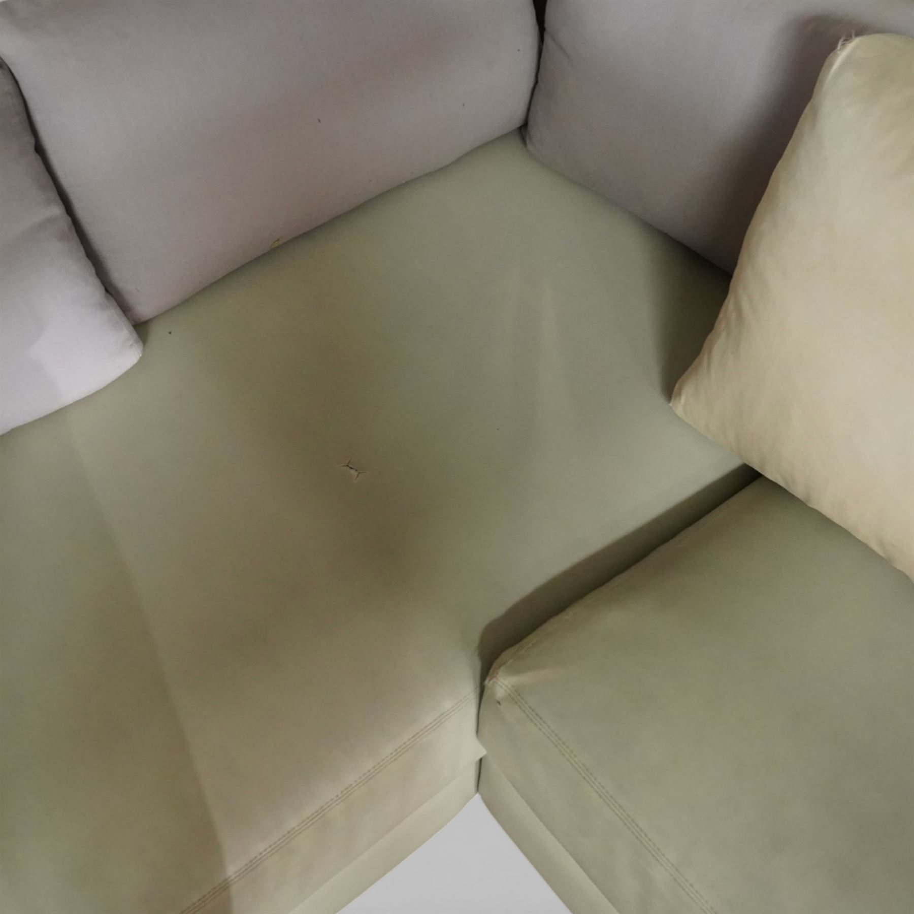 Christian Liaigre (1943-2020) - 'Arpege' handmade L-shaped sectional sofa, upholstered in neutral leather, with broad squared arms, deep seat cushions, angled chaise section, loose back cushions, raised on block feet