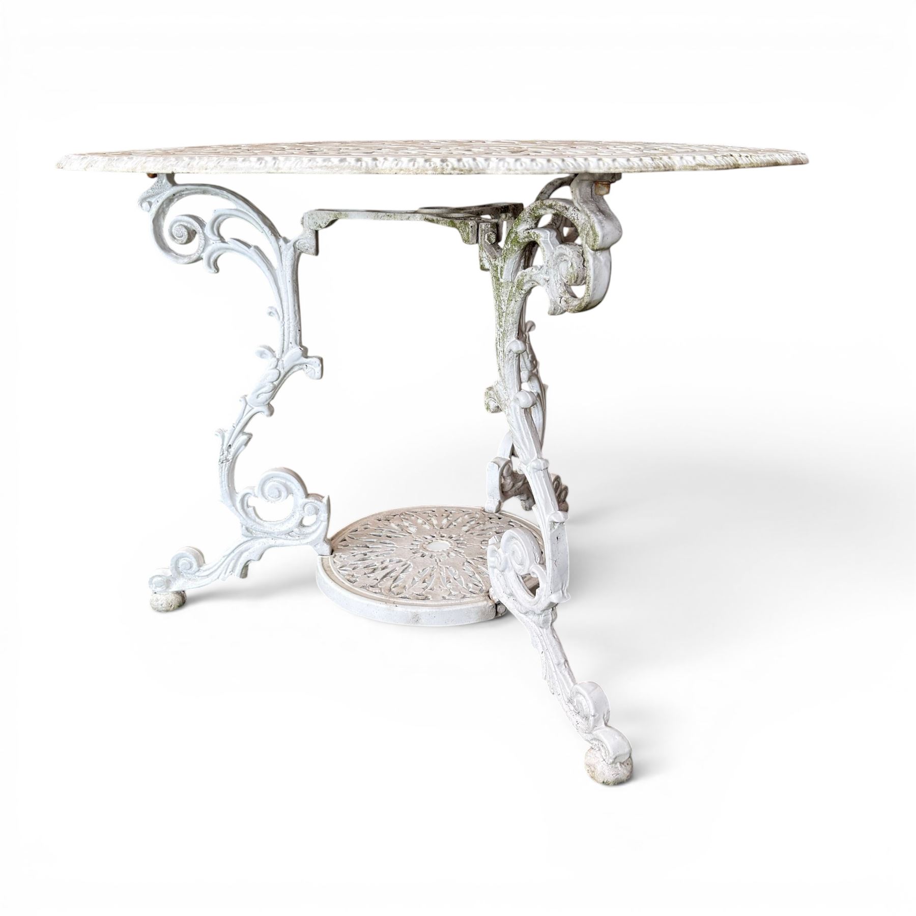 Victorian design cast aluminium circular garden table and four armchairs, ornate grape design in antique white paint