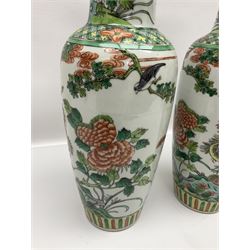 Pair of Chinese famille verte vases of baluster form decorated with phoenixes and birds in a floral garden, H31cm