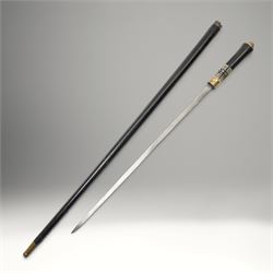 Early 20th century Indian concealed sword-stick, the black wooden scabbard and grip with c...