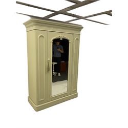 Victorian white painted wardrobe, the projecting cornice over centre mirror glazed door, the interior fitted with drawer and two hinged compartments, plinth base