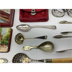 Small quantity of silver, to include two Edwardian napkin rings with pierced decoration, Georgian teaspoon, Victorian sifting spoon, early 20th century Kings pattern cake knife, etc., together with a group of assorted silver plated flatware, a meerschaum pipe bowl modelled as the head of a lady, various cheroot holders, etc. 