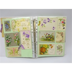  Modern ring binder album of over two hundred and eighty predominantly Victorian Christmas greeting cards, single sheet and folded, including hand painted celluloid, embossed, floral, pierced and paper lace, novelty shapes of flower basket, cob-web, horse shoe, leaf, etc  