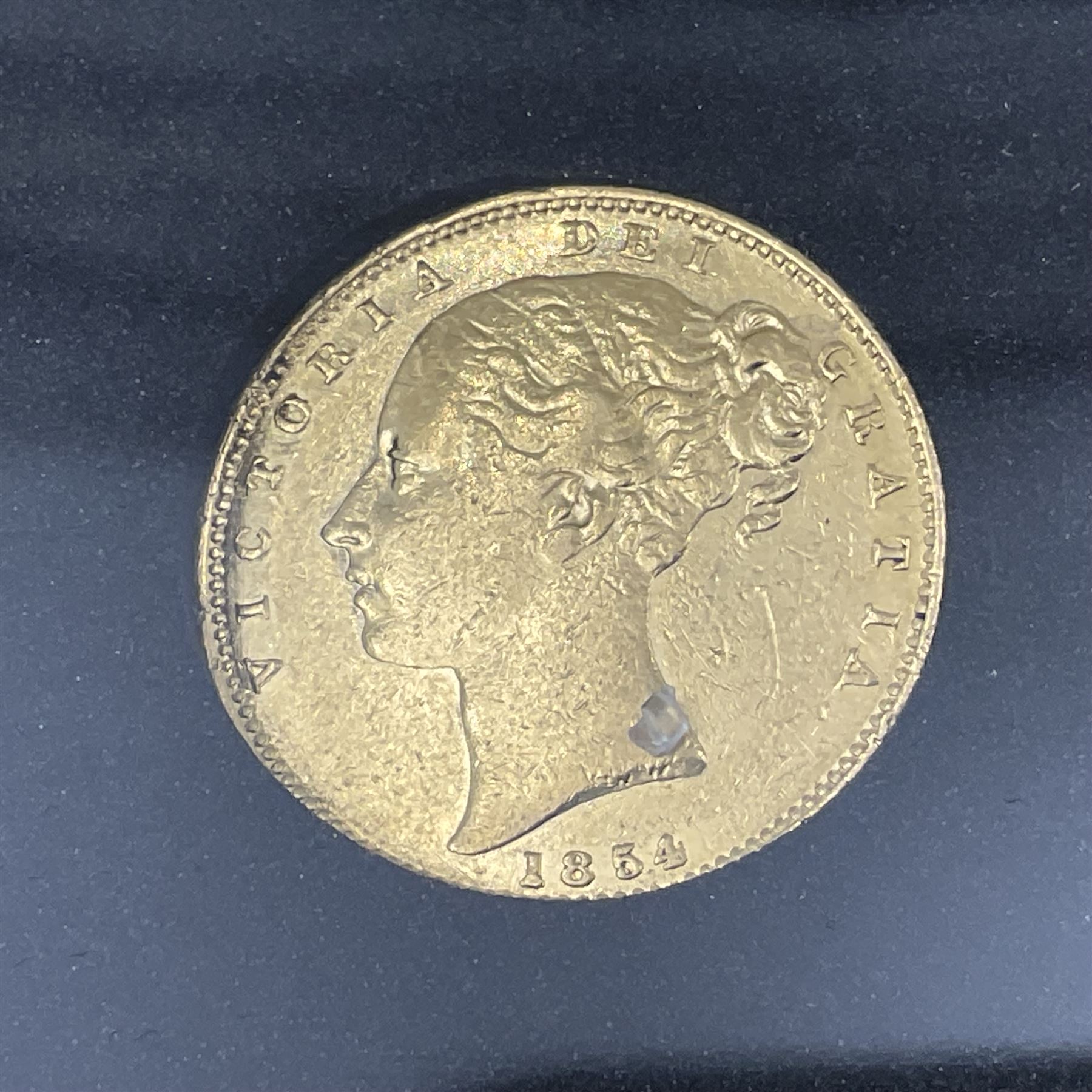 Queen Victoria 1854 gold full sovereign coin, 'The Shipwreck Sovereign', housed in a display case with information leaflet