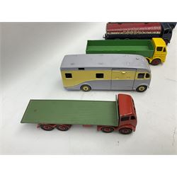 Dinky - five unboxed and playworn/repainted commercial vehicles comprising Foden Regent tanker, Horse Box, Foden flatbed lorry and two Foden flatbed lorries with planked sides (5)