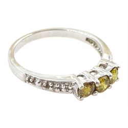 18ct white gold three stone fancy yellow diamond ring, with diamond set shoulders, hallmarked, total yellow diamond weight approx 0.40 carat