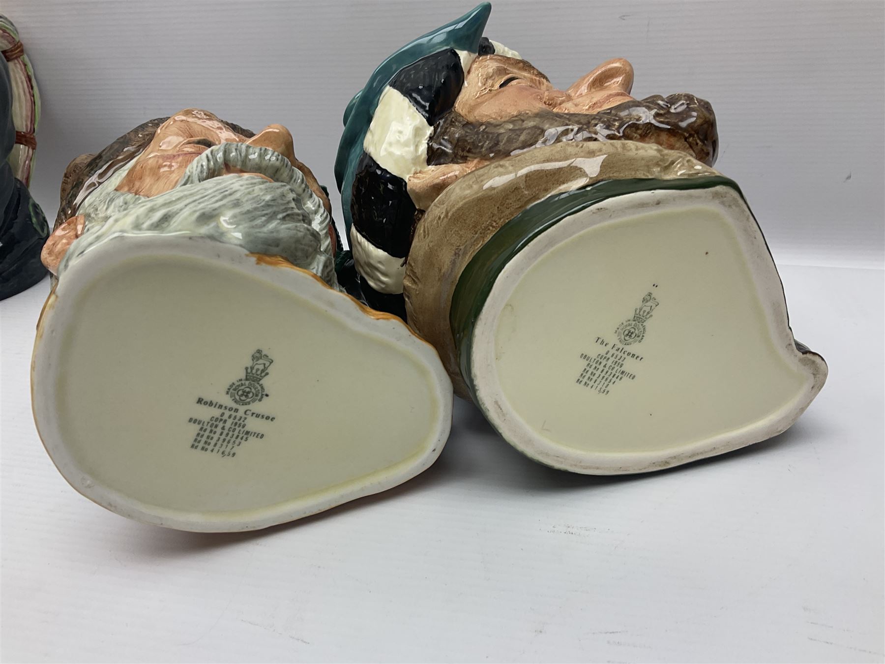Large collection of Royal Doulton character jugs, to include Robinson Crusoe D6532, Tam O Shanter D6632, The Falconer D6533 etc, together with similar charater jugs and toby jugs   