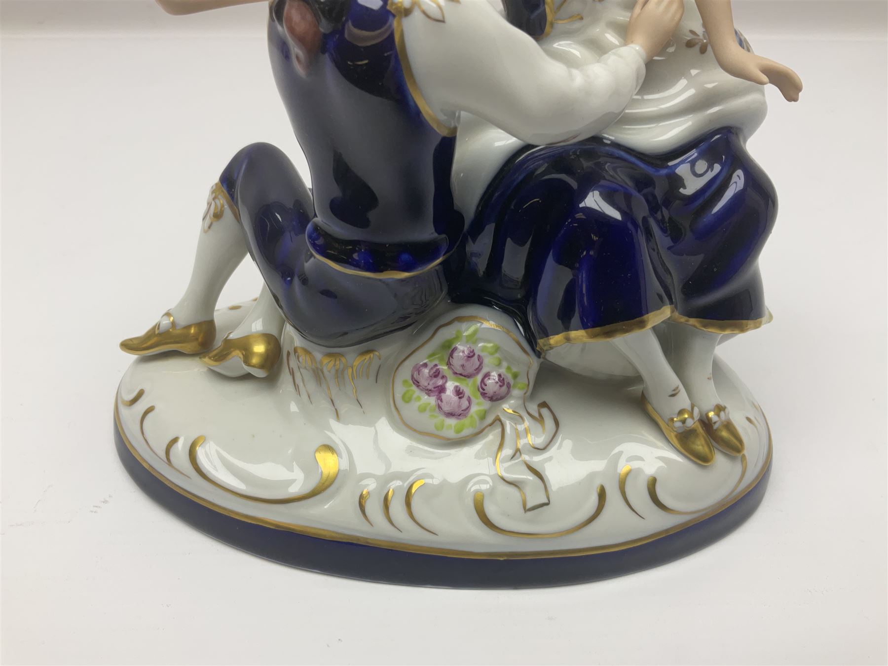 Two Royal Worcester figures, comprising Spirit of the Millennium and Spring, together with Royal Dux figure of two lovers