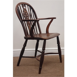  19th century yew wood and elm Windsor armchair, stick and wheel splat back, turned supports connected by crinoline stretcher  