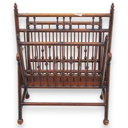 Arts and Crafts mahogany magazine stand, in the manner of Christopher Dresser, folding magazine stand, rectangular divided slatted compartments with turned spindle galleries and ball finials, the sides forming an X-frame action, raised on turned supports united by stretchers