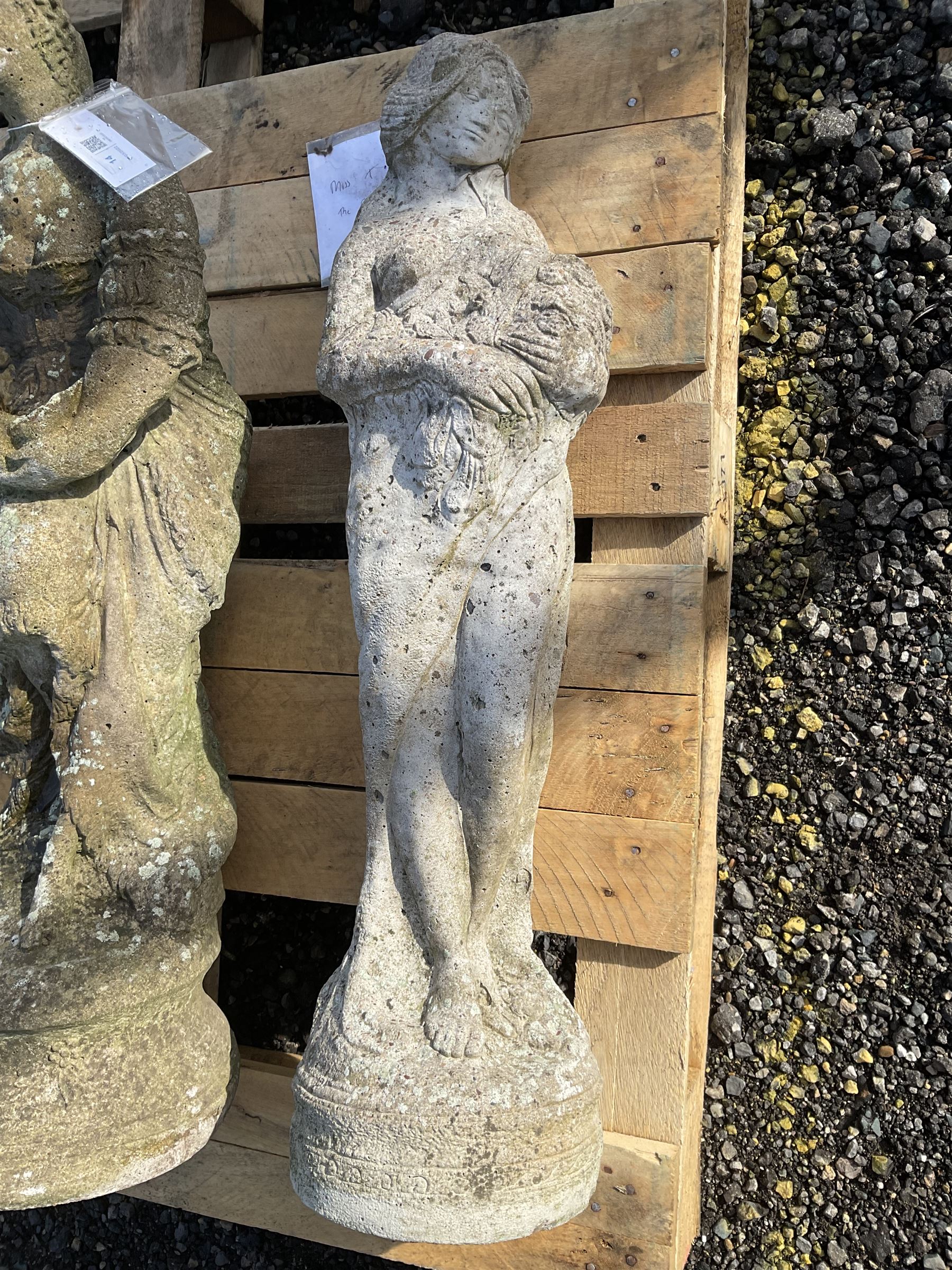 Three composite stone garden figures of ladies THIS LOT IS TO BE