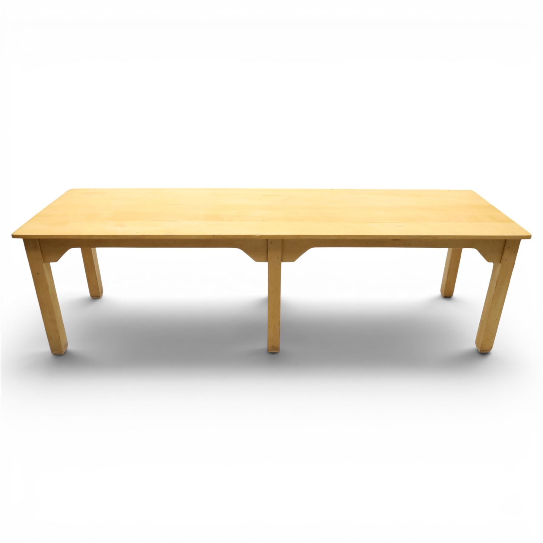 Mid 20th century beech dining table, rectangular top with rounded corners, plain apron with shaped brackets, raised on six square section supports