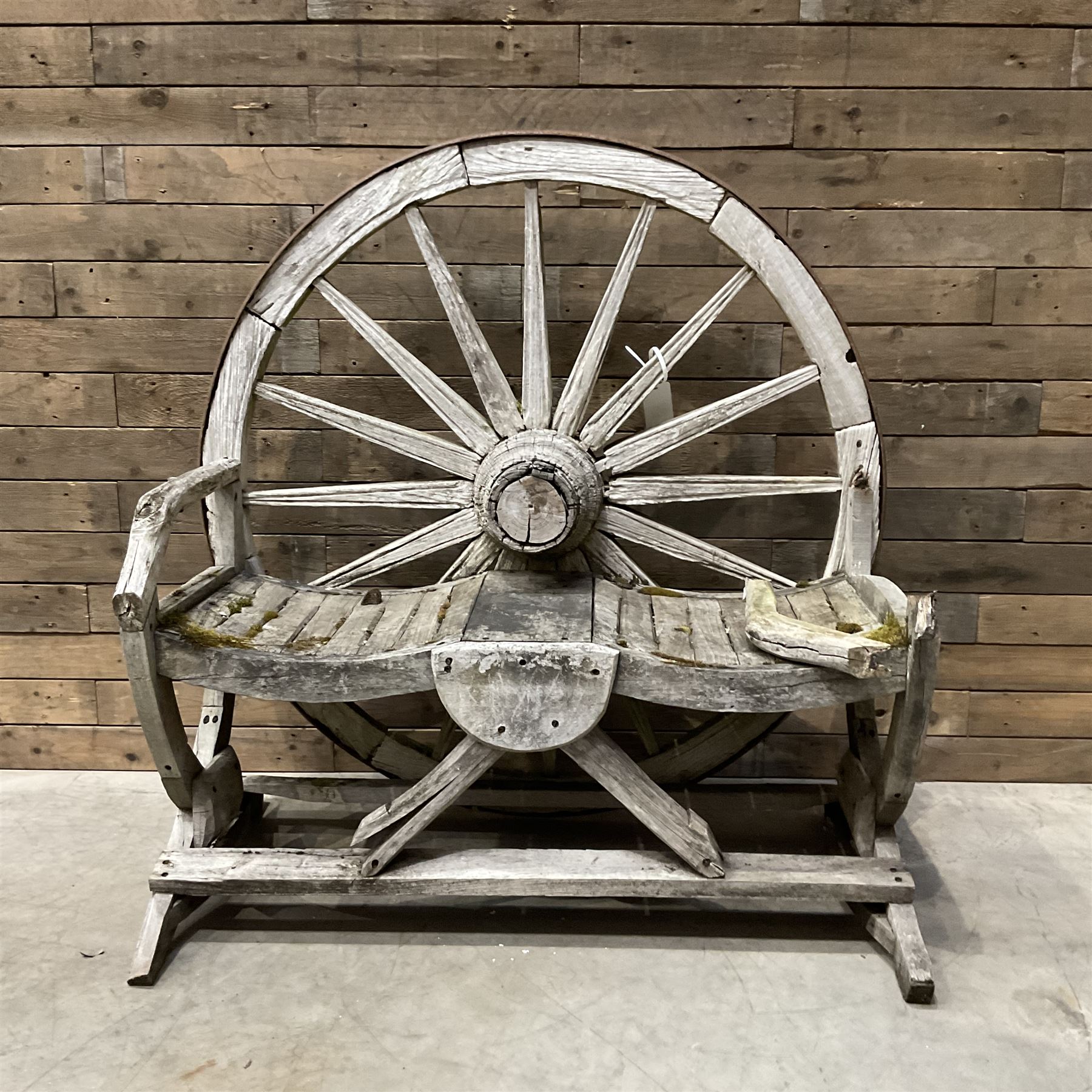 Early 20th century timber framed cartwheel garden bench