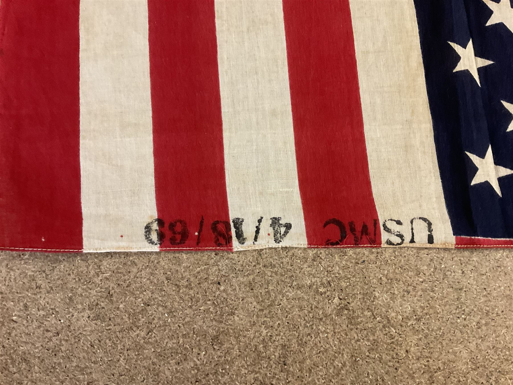 Vietnam War; two North Vietnamese military flags, together with a United States Marine Corps Vietnam period stars and stripes flag 