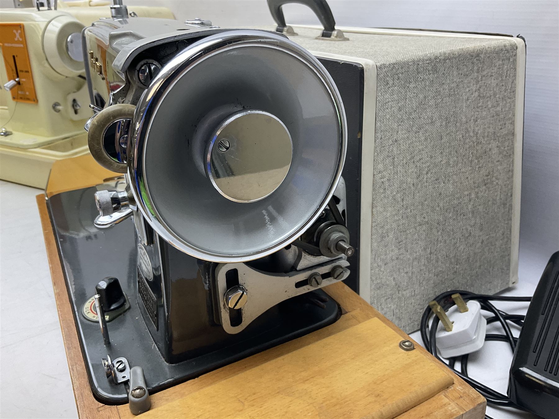 Vintage Brother electric sewing machine in case together with a Frister and Rossmann model 45 sewing machine in case