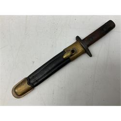 Italian Model 1891 Carcano knife bayonet with 30cm fullered steel blade, the cross-piece stamped VL1110; in steel scabbard with webbing frog L43cm overall; and another Italian fighting knife/bayonet in brass bound leather scabbard (2)