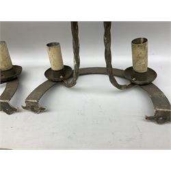 Gothic style iron chandelier with drip pans and twisted branches together with three matching twin wall sconces