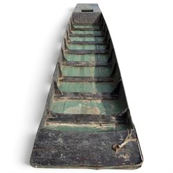 Large early 20th century plank-built wooden river punt, the long tapering hull with enclosed fore and aft decks, open green-painted ribbed interior, together with two paddles