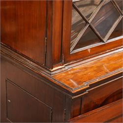 Large Georgian mahogany library bookcase, projecting moulded cornice with row of globular mounts, adjustable shelving enclosed by six astragal glazed doors, fitted with two slides and six panelled cupboard doors, two banks of five drawers, on moulded plinth base; together with two pairs of associated astragal glazed doors in mahogany, from the same property (W55.5cm x H168cm & W48cm x 168cm)