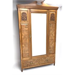 Late Victorian satin walnut and figured walnut wardrobe, projecting cornice over rectangular bevel edged mirror glazed door, carved and figured panels, drawer to base