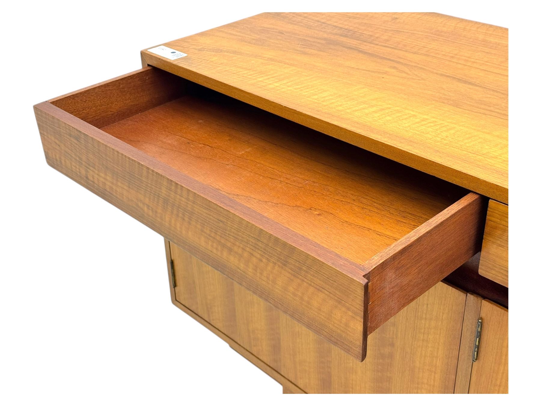 Younger - 1960s teak sideboard, three drawers over three cupboard, centre draw lined with baize with dividers, recessed handles with tapered feet