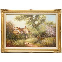 Les Parson (British 1945-): Thatched Cottage Overlooking a Blossoming Meadow, oil on canvas signed 49.5cm x 74.5cm