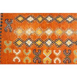 North Persian tribal rug, an orange field and six rows of lozenges, with a border of ram's horn motifs