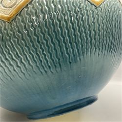 Burmantoft pottery jardiniere, moulded with leaf decoration and a lobed shell rim, upon a blue ground, with impress mark beneath H24cm 