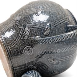 Gus Mableson - two studio pottery teapots, the larger example with a repeating floral pattern upon a brown ground, each with impressed makers marks below the handle, largest H18cm