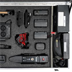 RED Epic-W Helium 8K camera body serial no. 13024E6A9, with RED EVF, three RED Mini Mag 512GB cards, one 480 Mini Mag card and reader, two RED V-Mount batteries and charger, RED top handle, Wooden Camera Easy Top top plate and one other top plate, various accessory cables, Wooden Camera bridge plate for 19mm studio rods, 12 inch Wooden Camera Dovetail plate and four 19mm studio rods to include two 380mm and two 610mm, with original Epic-W camera box and contained within a custom cut flight case