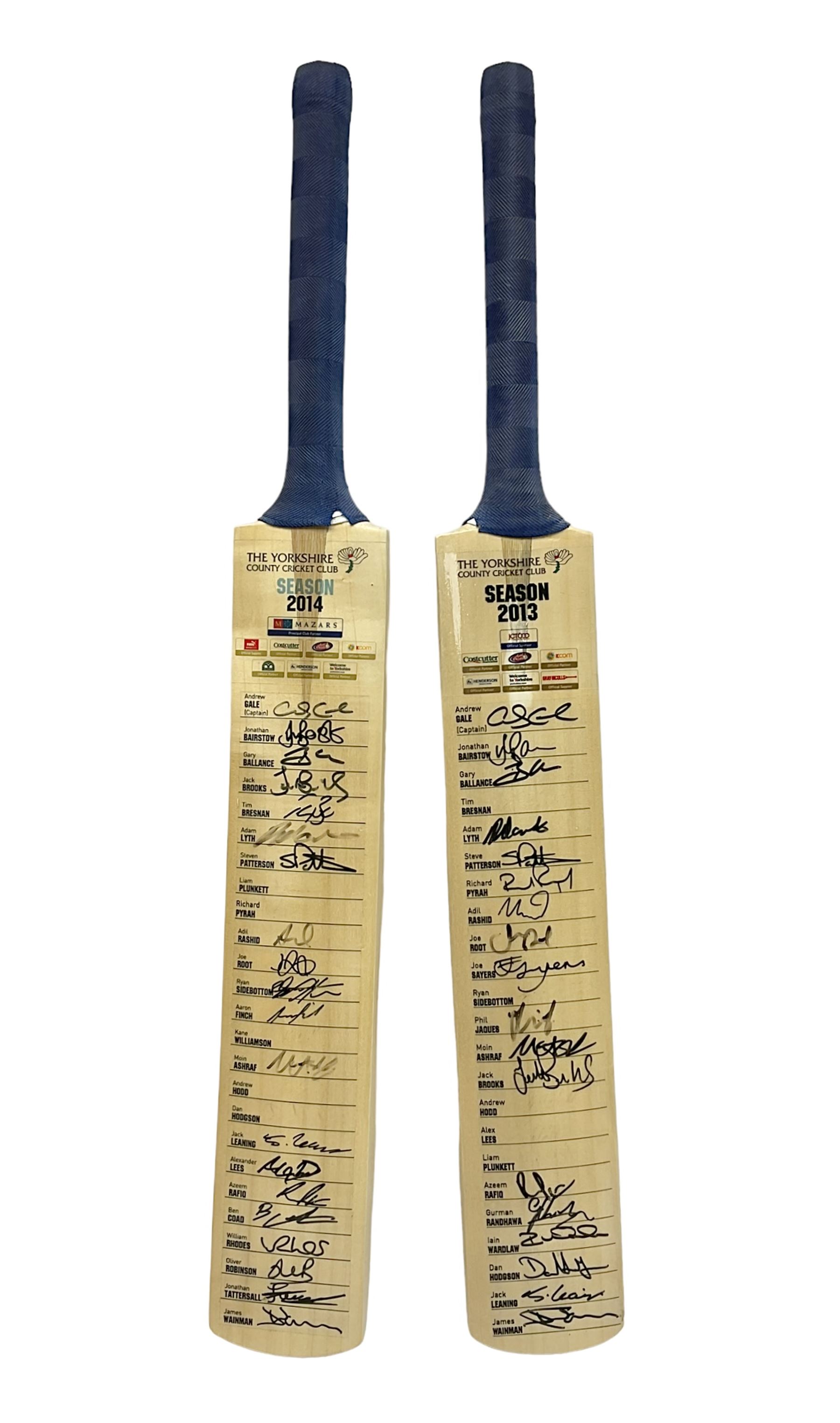 Two signed Yorkshire County cricket bats, from 2013 and 2014 seasons, bearing signatures including Johnny Bairstow, Joe Root, Tim Bresnan, Andrew Gale, etc