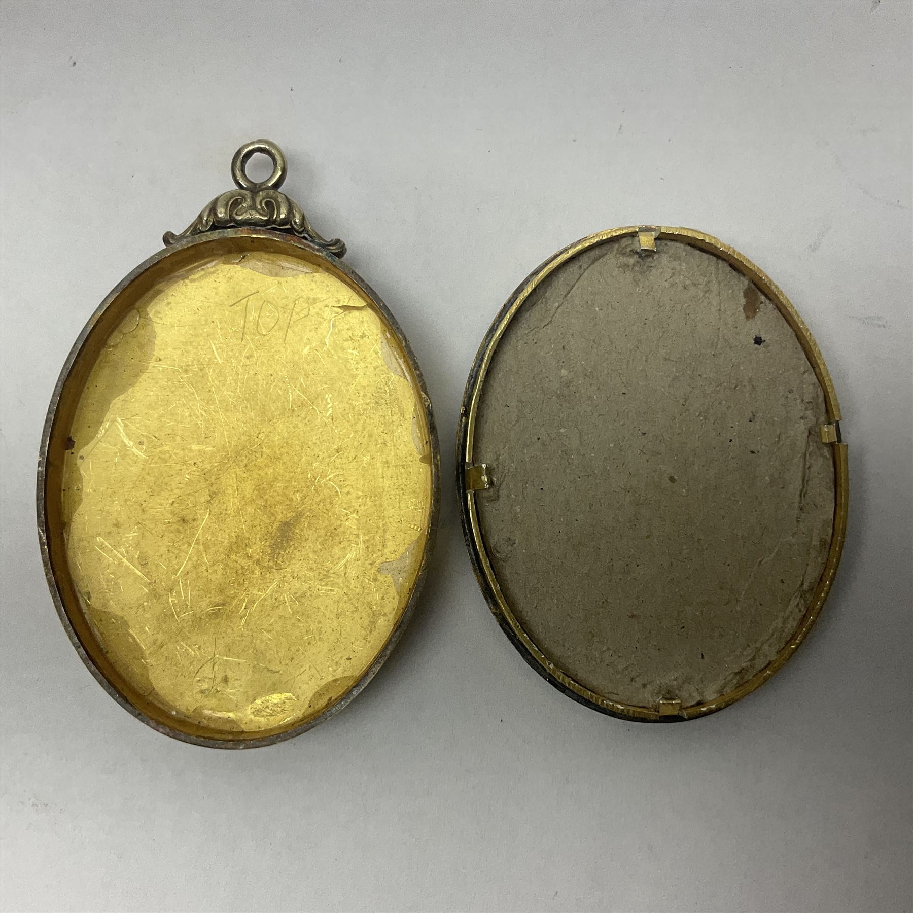 Silver and enamel oval locket pendant, inscribed Pudsey Philatelic Society President, and decorated in enamel with a Penny Black stamp, opening to reveal a gilt interior, with presentation engraving verso, hallmarked Haseler & Restall, Birmingham 1981, contained within fitted case, H6.5cm
