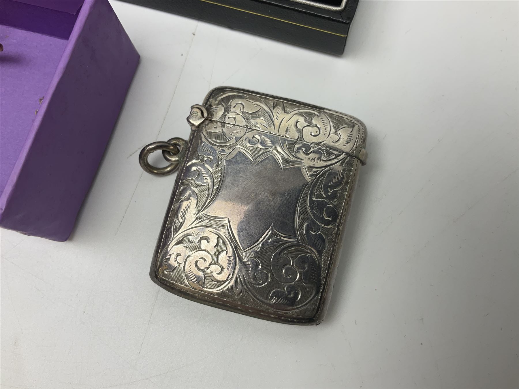 Victorian and later silver jewellery including fob with rose gold cartouche, cross pendant, enamel Yorkshire rose tie pin and fob bracelet,  together with an Edwardian silver vesta case, hallmarked Birmingham 1907, a wooden pocket watch case and three costume brooches 