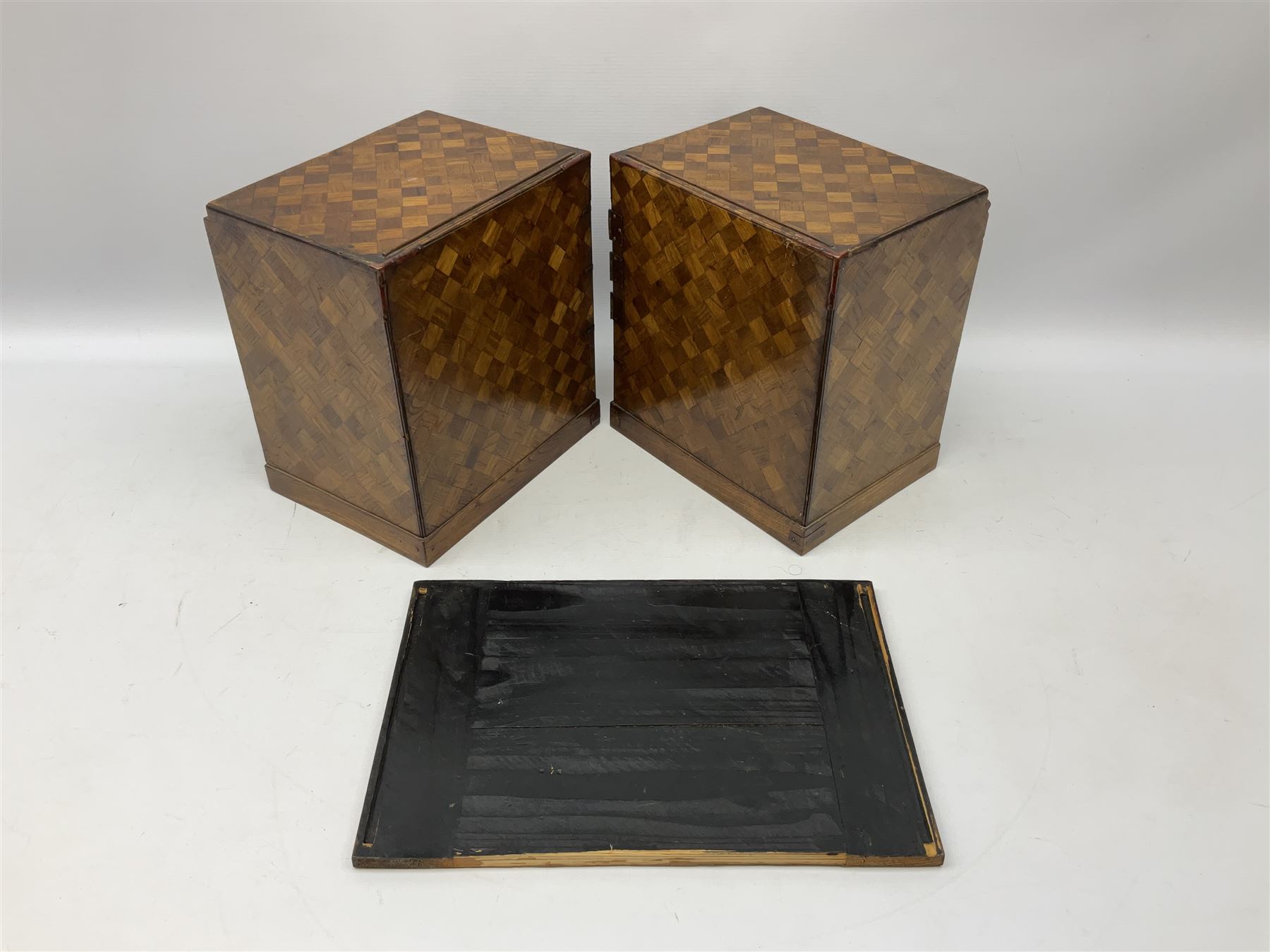 Japanese miniature kneehole desk decorated with parquetry inlay, the loose leaf top resting on one pedestal cabinet with four drawers, and another with hinged cupboard door opening to reveal two interior drawers above a lower drawer, H26cm, W68.5cm D24cm