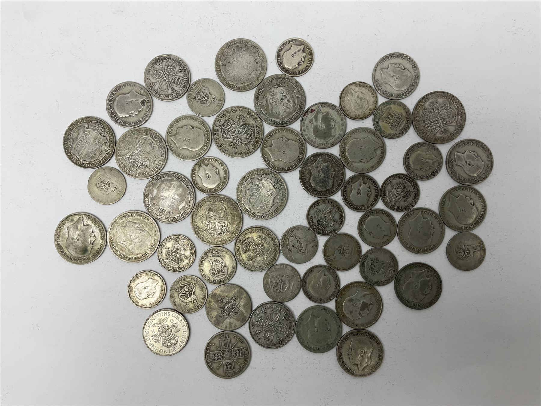 Approximately 480 grams of Great British pre 1947 silver coins, including shillings, florins and halfcrowns