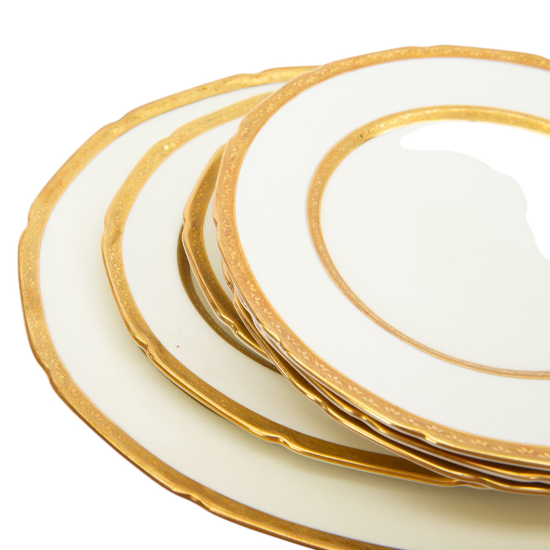 Royal Doulton 'The Balmoral' pattern dinner service for twelve place settings, comprising dinner plates, soup bowls and saucers, side plates, cake plates, three graduating meat platters, pair of tureens with covers and a pair of sauce boats with saucers, all with printed marks beneath