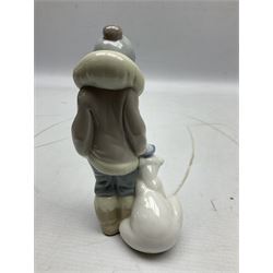 Seven Lladro figures, comprising Playful Puppy no 9135, Platero and Marcelino/Boy Hugging Donkey no 1181, Mini Seal Family no 5318, Attentive Polar Bear no 1207, Seated Polar Bear no1209, Eskimo Boy with Pet no 5238 and Girl with Geese no 1035, together with Nao goose