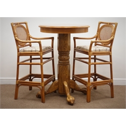  Light oak circular pedestal table, the four supports with ball and claw feet (D76cm, H111cm) and two bar chairs (3)  
