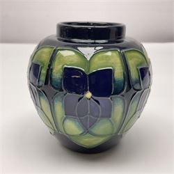 Moorcroft ginger jar in Violet pattern by Sally Tuffin upon green ground, with printed mark beneath, H11cm