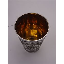 Victorian silver four piece christening set, comprising a beaker mug, napkin ring, fork and spoon, with bright cut floral decoration and monogrammed initials to each item, mug hallmarked Mappin & Webb (John Newton Mappin), Sheffield 1884, within tooled leather fitted case