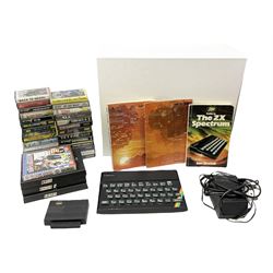 Sinclair ZX spectrum with basic programming guides and game cassettes, including the quest for the holy grail, the empire fights back, space raiders etc  