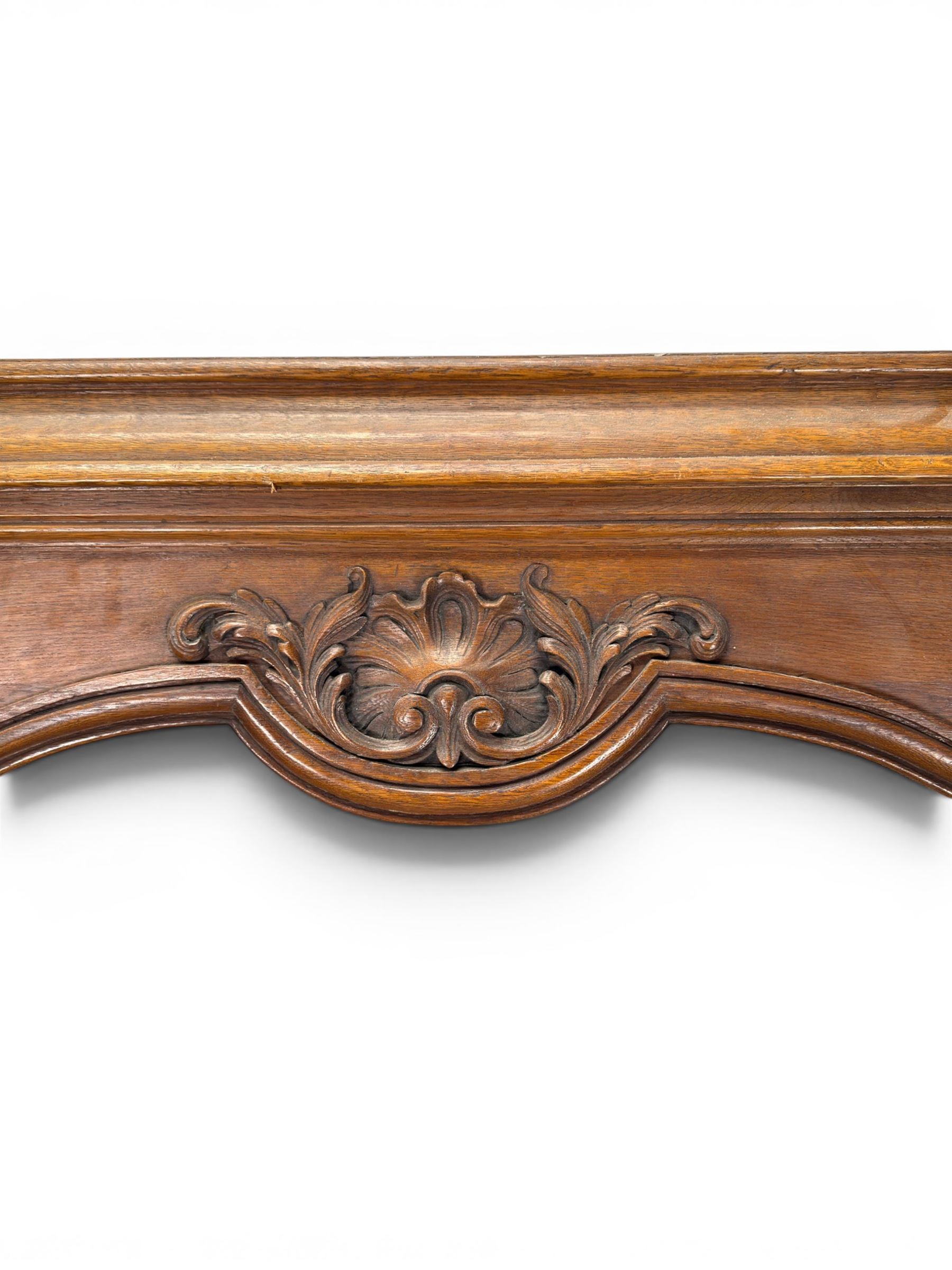 Early 20th century French oak window surround, shaped top with carved shell and acanthus leaf detail 