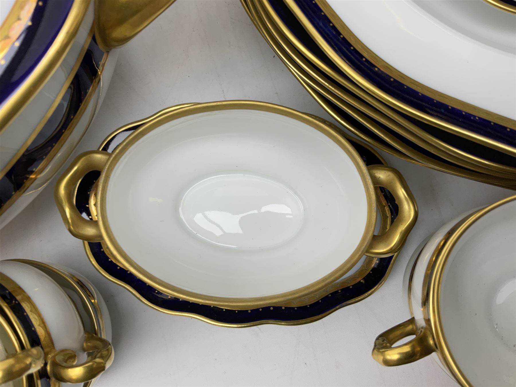 Pirkenhammer of Czechoslovakia Carlsbad pattern tea and dinner for twelve place settings to include dinner plates, soup bowls, side plates, covered tureen, tea cups and saucers, coffee cups and saucers, teapot, milk jug, covered surier, etc, with an addition twelve dinner plates (110)