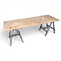Vintage wooden plank trestle table, on two painted folding stands