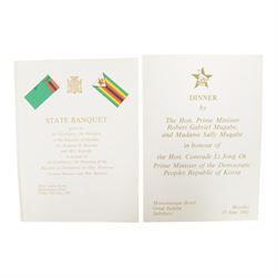 Menu signed by Robert Mugabe, Canaan Banana, and Kenneth Kaunda,  'Dinner by The Hon. Prime Minister Robert Gabriel Mugabe and Madame Sally Mugabe in honour of the Hon. Comrafe Li Jong Ok Prime Minister of the Democratic Peoples Republic of Korea, H21cm
Provenance: the vendor's husband was Food and Beverage Manager at the meal and had the menu signed