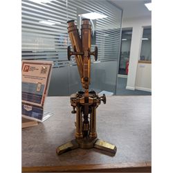 19th century brass binocular microscope by R&J Beck, 31 Cornhill London, numbered 6386, with rack and pinion focusing, housed in wooden case with case of accessories, including eyepieces, objective lenses and condenser