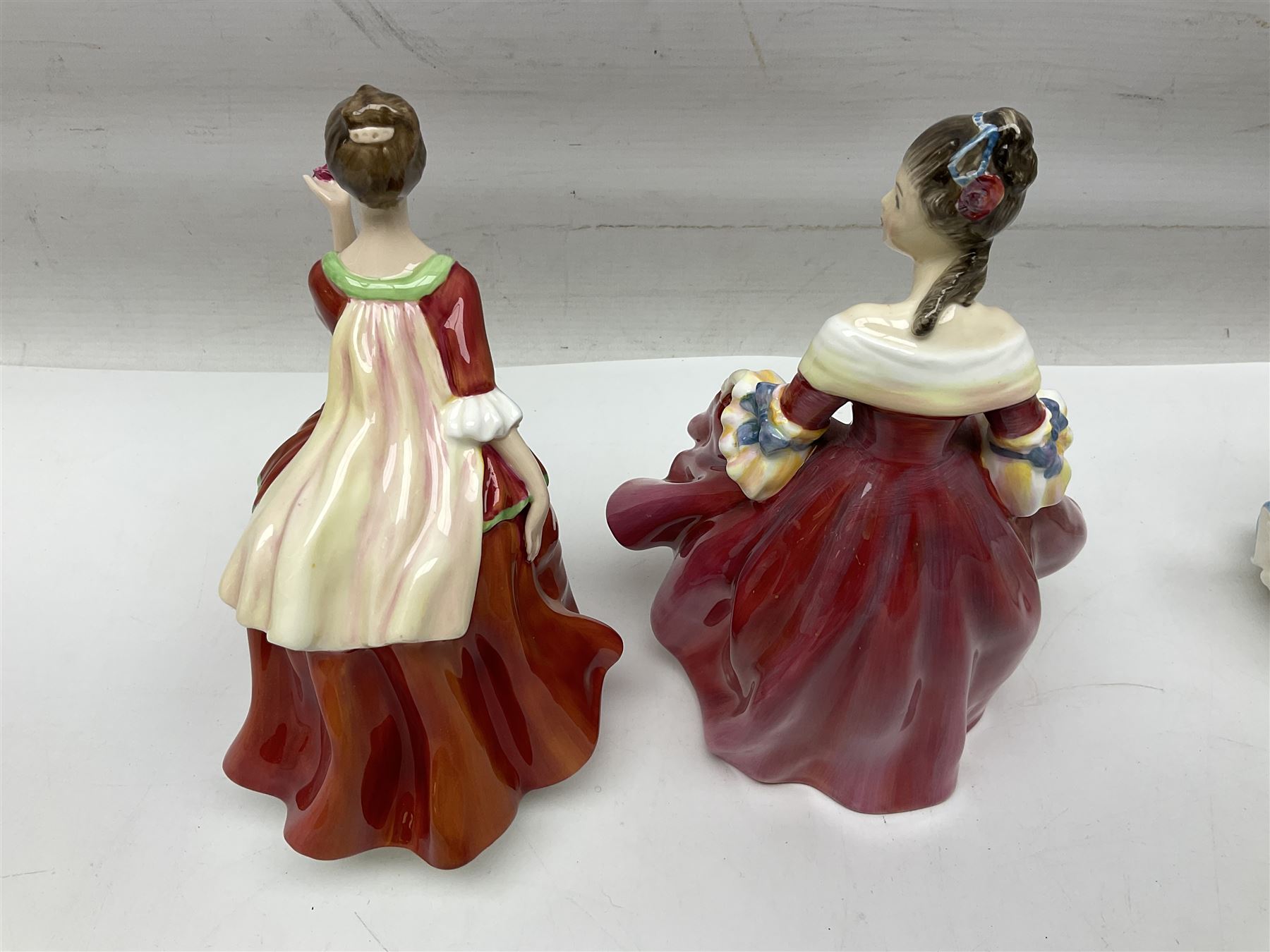 Five Royal Doulton figures, comprising Flower of Love HN3970, Emily HN3688, Southern Belle HN2229, Helen HN3886 and My Love HN2339, all with printed mark beneath, some with boxes, together with a Royal Doulton Figures reference book by D Eyles and R Dennis