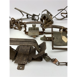Ten animal traps including 'Li-Lo' wire spring rabbit trap, H. Lane fox trap, mole traps, Sidebotham trap etc. Auctioneer's Note: These traps are sold as artefacts for ornamental purposes only as the use of some of them is illegal.