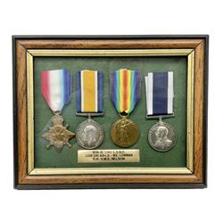 WW1 Naval Long Service and Good Conduct group of four medals comprising British War Medal, 1914-15 Star and Victory Medal awarded to J238220 W.E, Lowman L.S.R.N. and LSGC Medal to 238220 W.E. Lowman HMS Nelson; all with ribbons; mounted and glazed in mahogany stained frame with plaque